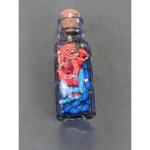 Charming Glass Bottle‎ Filled With Colorful Beads and Necklaces